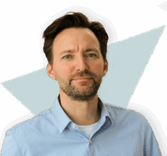 Flexible, professional man standing confidently in front of a geometric background, symbolizing career growth and opportunity at Keylane.