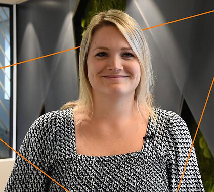 Building a diverse and innovative team for Keylane careers, showcasing a professional woman smiling in a modern office environment, emphasizing career growth and opportunities at Keylane.